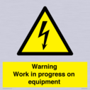 warning-work-in-progress-on-equipmentwith-electrical-hazard-symbol~